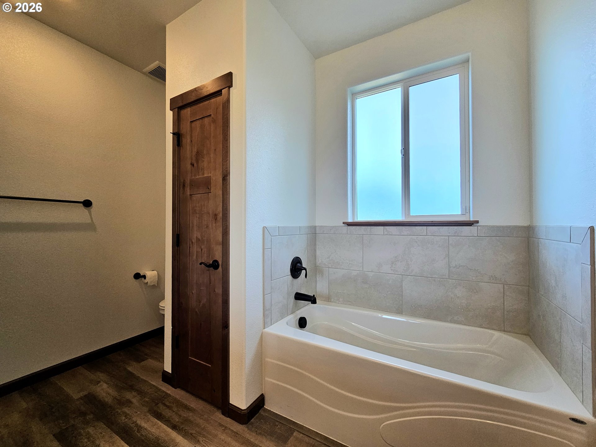 98205 Sunforest Court Brookings, OR 97415 - Photo 24 of 45 a bathroom with a bathtub and a shower