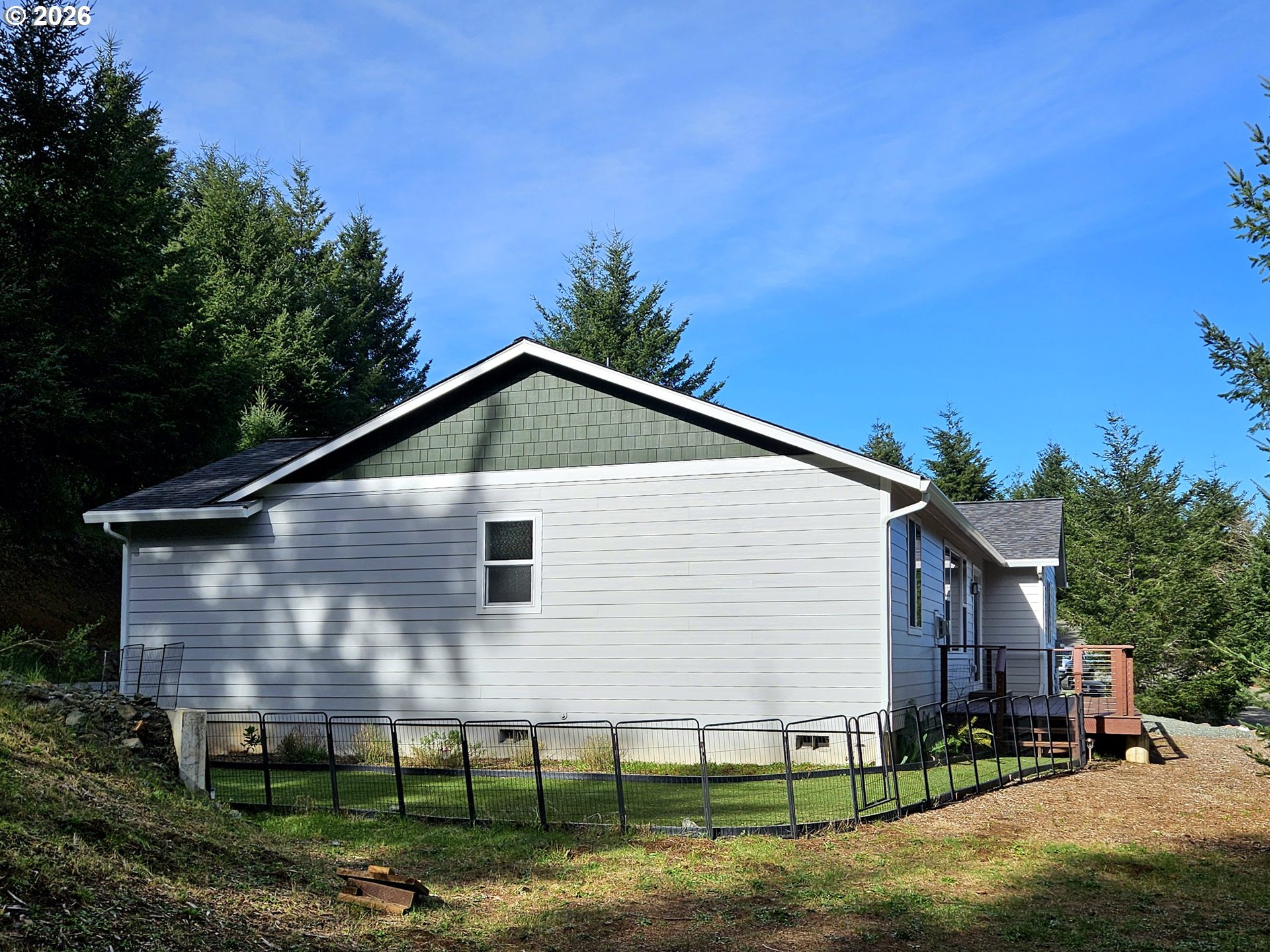 98205 Sunforest Court Brookings, OR 97415 - Photo 36 of 45 a view of a house with yard