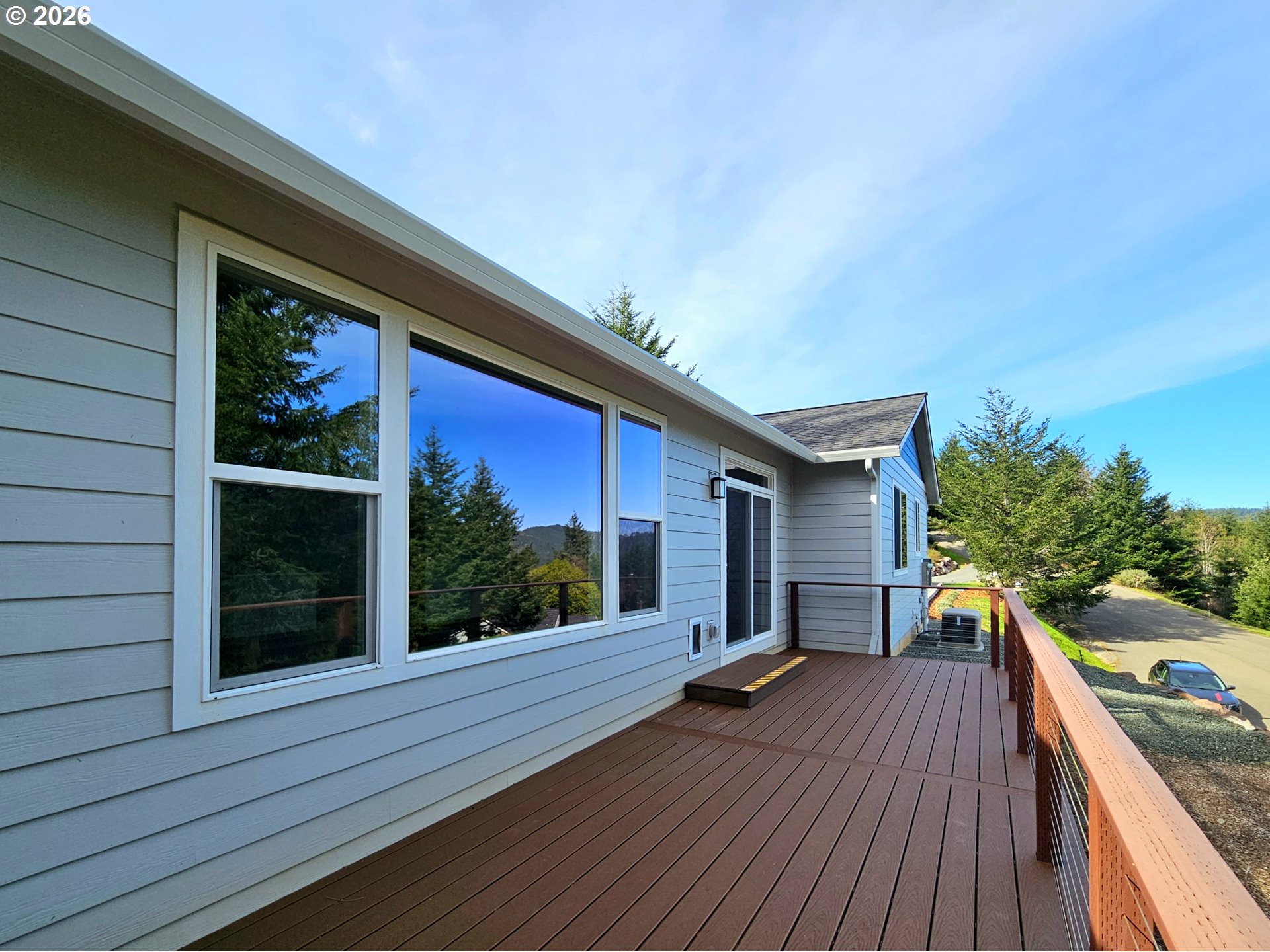 98205 Sunforest Court Brookings, OR 97415 - Photo 7 of 45 a house view with a seating space