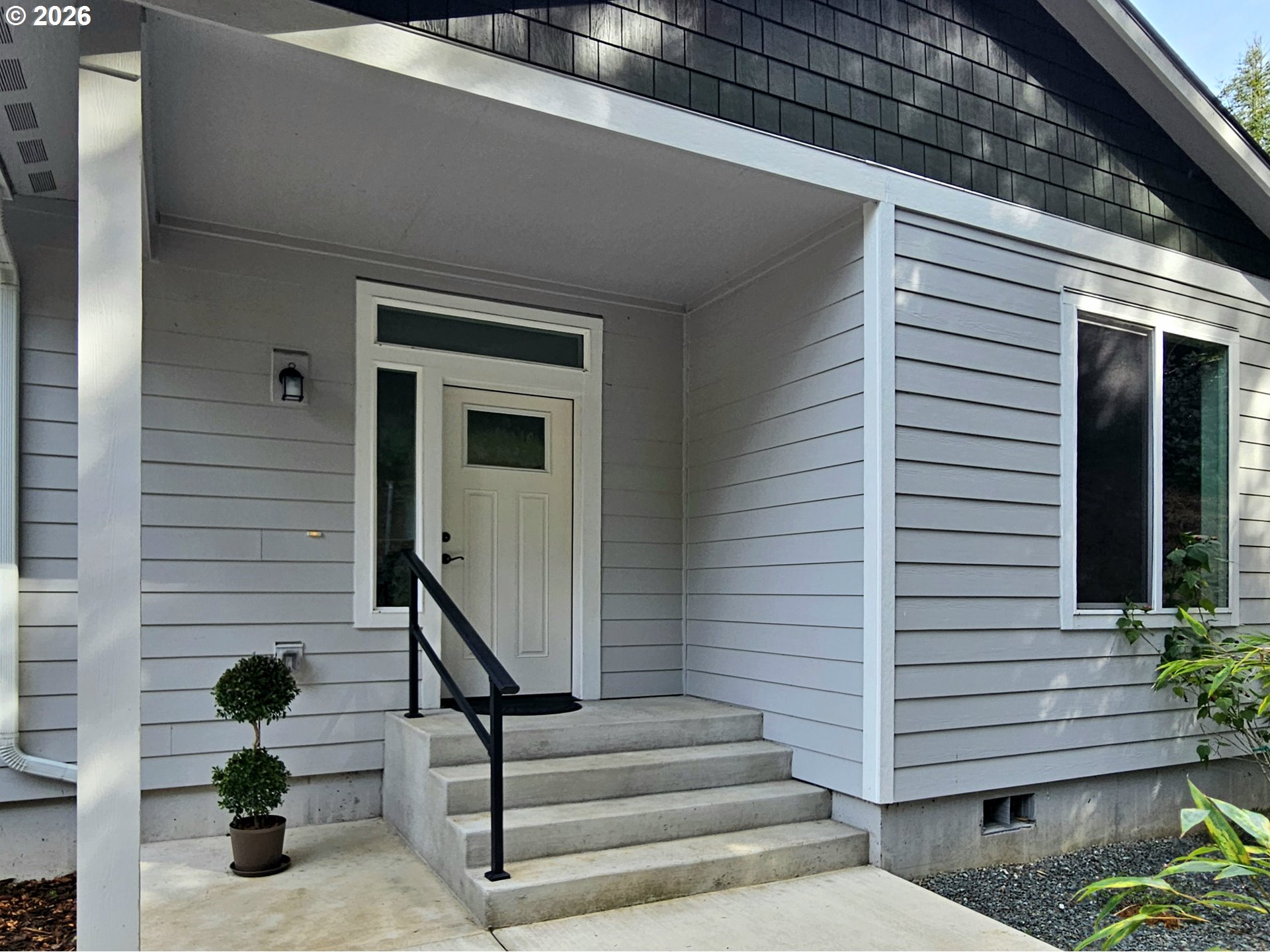 98205 Sunforest Court Brookings, OR 97415 - Photo 10 of 45 a view of entryway with a front door