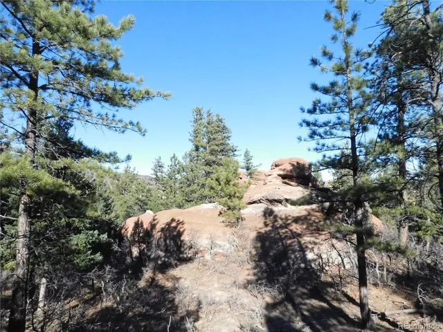 a view of a house with a mountain in the background