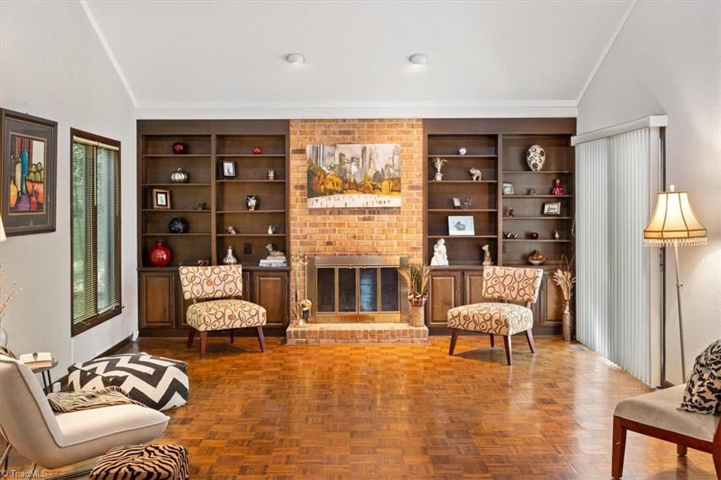 3619 Gramercy Road Greensboro, NC 27410 - Photo 3 of 49 Great Room with Fireplace and built in display/book shelves.