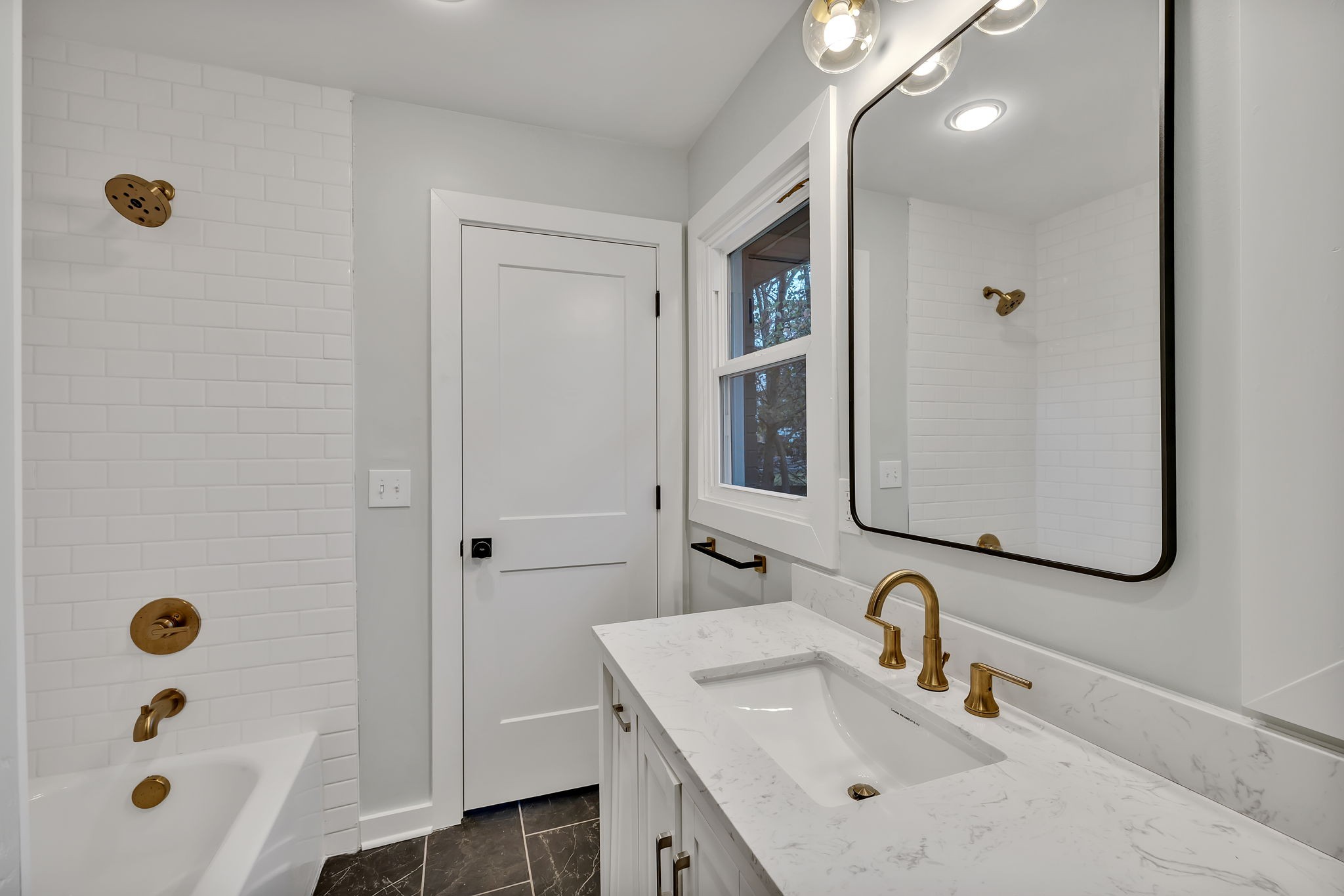 5315 Anchorage Drive Nashville, TN 37220 - Photo 19 of 38 a bathroom with a sink a mirror a vanity and shower