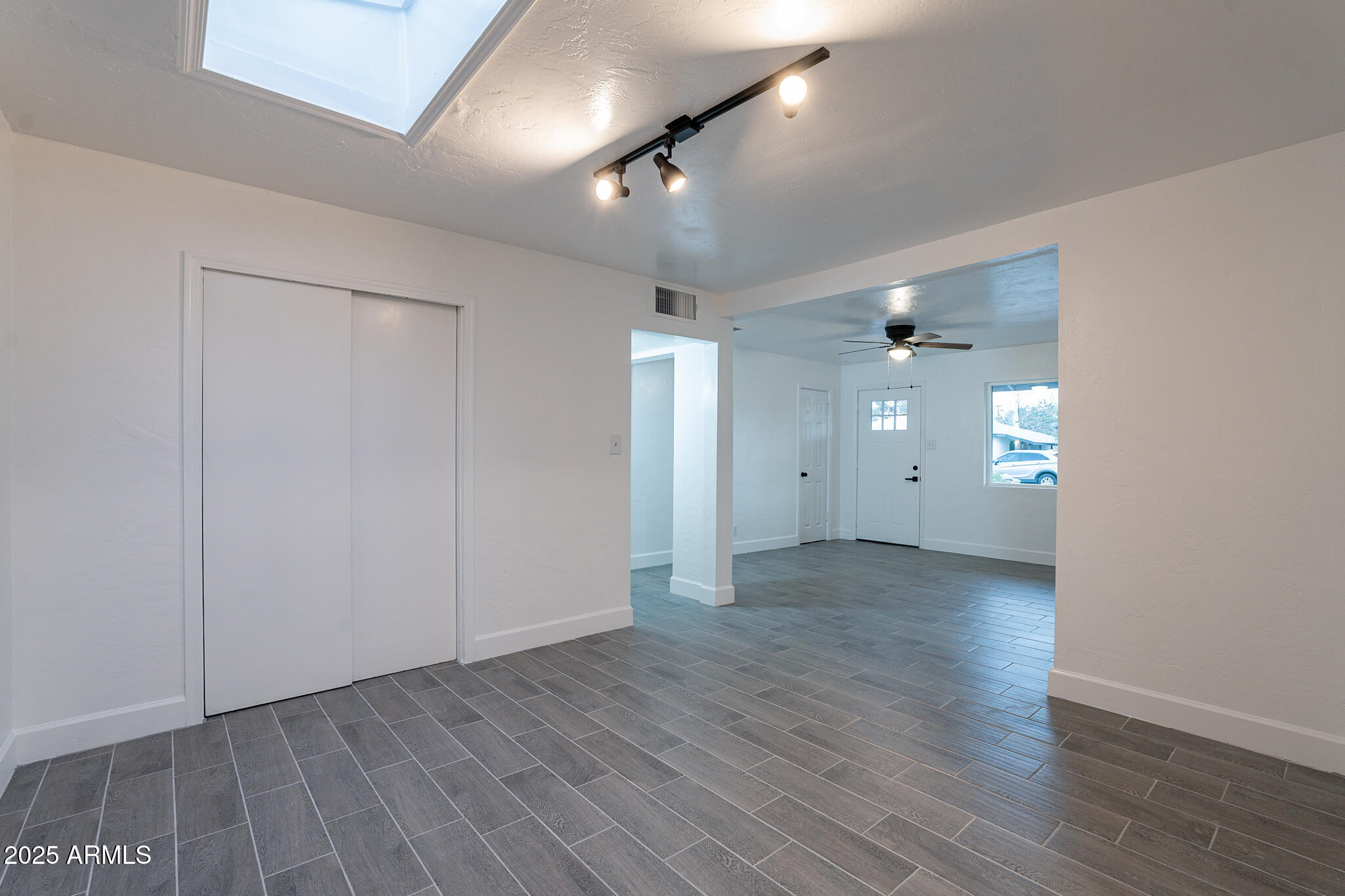 536 West 18th Street Tempe, AZ 85281 - Photo 20 of 32 an empty room with wooden floor and a ceiling fan