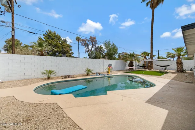 a view of a swimming pool with a patio