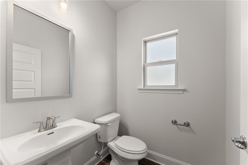 478 Magnolia Grove Place Cornelia, GA 30531 - Photo 16 of 38 a bathroom with a sink a toilet and a mirror