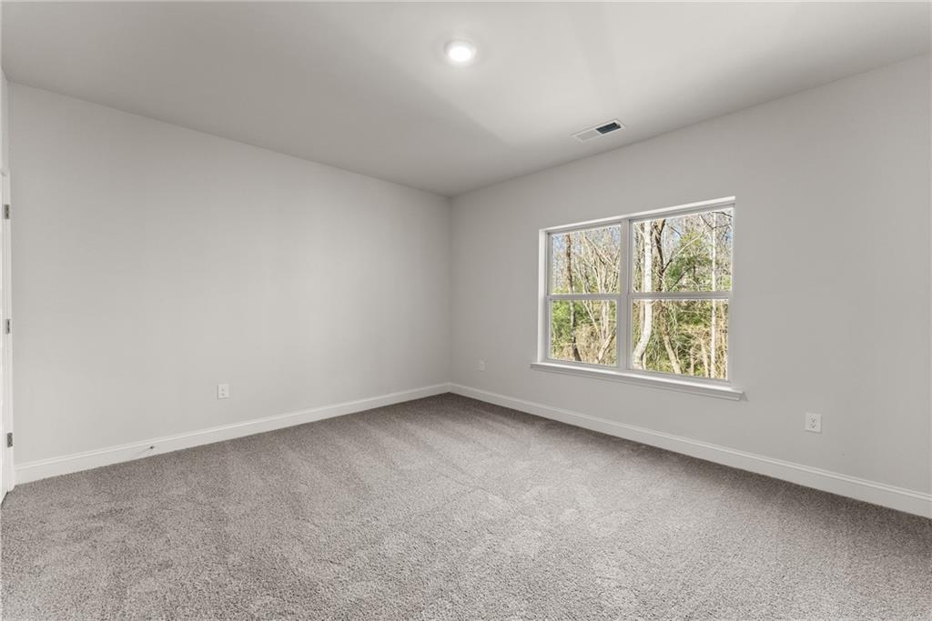 478 Magnolia Grove Place Cornelia, GA 30531 - Photo 18 of 38 an empty room with windows