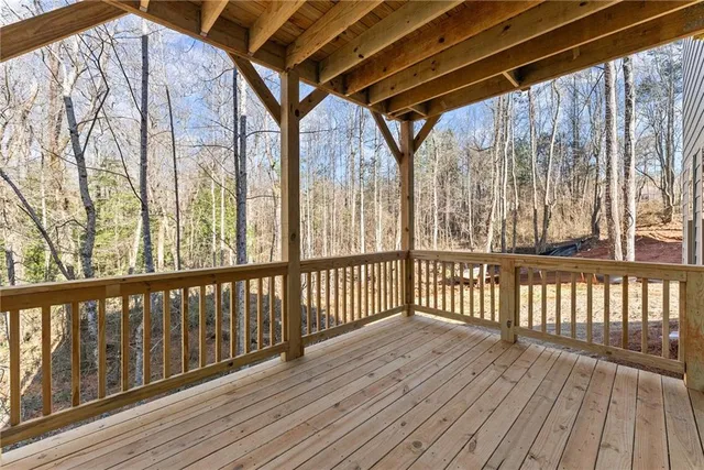 a view of wooden balcony with wooden floor