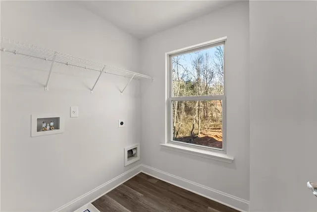 a view of room with window and hardwood floor