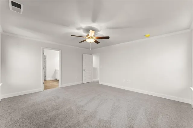 a bathroom with a bathtub shower and toilet