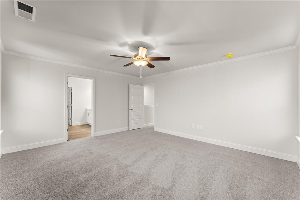 478 Magnolia Grove Place Cornelia, GA 30531 - Photo 34 of 38 a view of an empty room with a ceiling fan