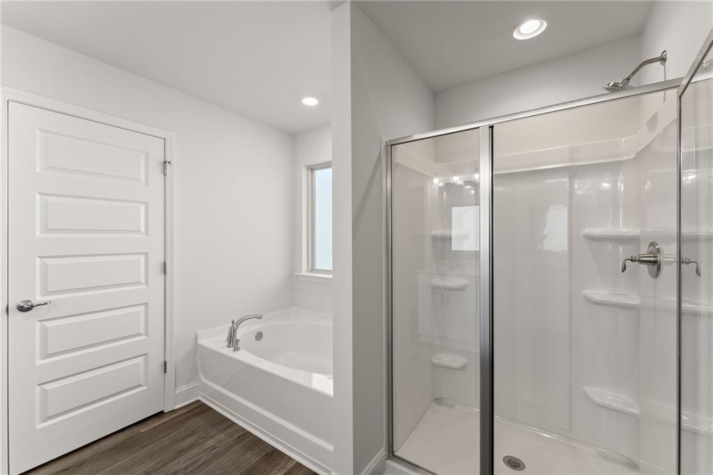 478 Magnolia Grove Place Cornelia, GA 30531 - Photo 37 of 38 a bathroom with a bathtub shower and toilet