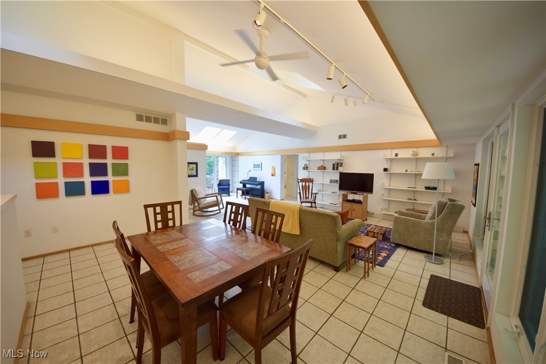 3559 Birchtree Path Cleveland, OH 44121 - Photo 7 of 37 Dining room with track lighting, light tile patterned floors, and ceiling fan