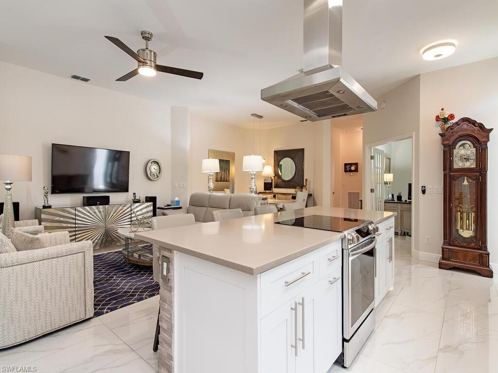 901 Marblehead Drive, Unit B1 Naples, FL 34104 - Photo 4 of 13 a view of living room kitchen sink and fireplace