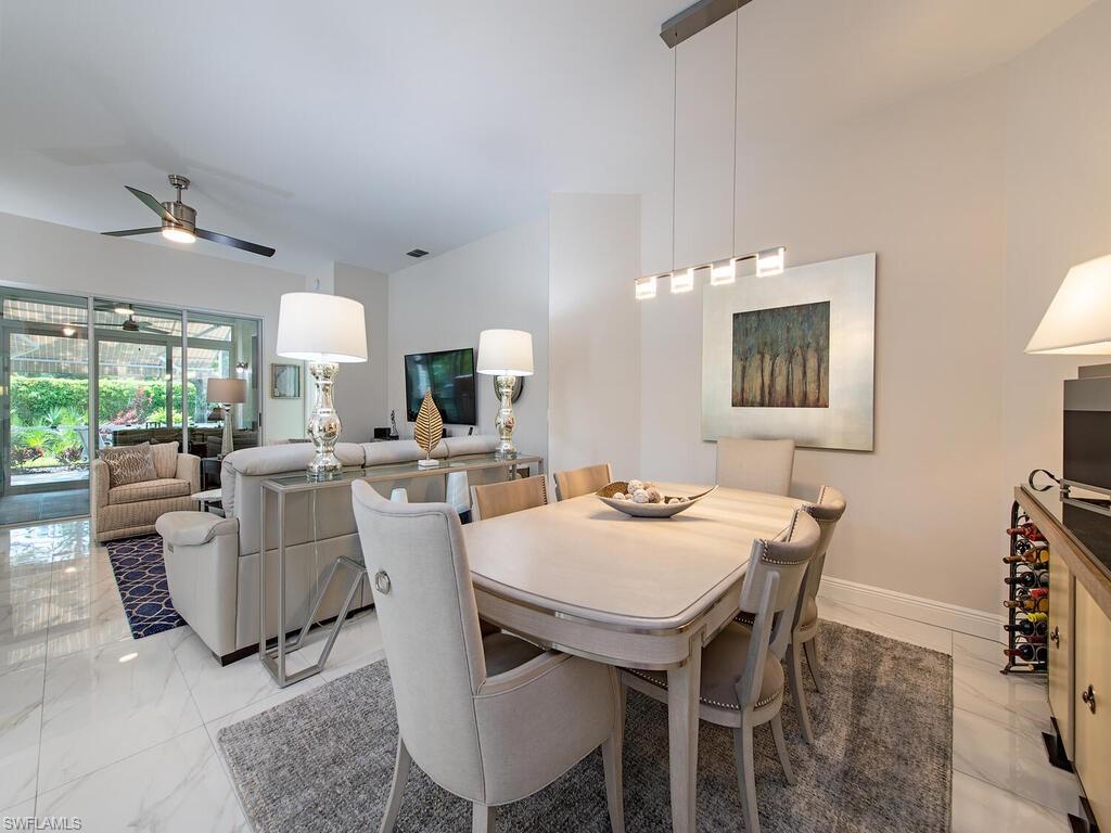 901 Marblehead Drive, Unit B1 Naples, FL 34104 - Photo 5 of 13 a view of a dining room with furniture