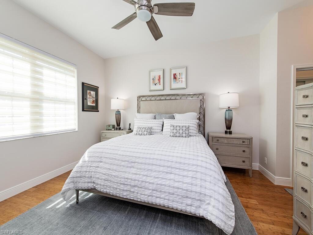 901 Marblehead Drive, Unit B1 Naples, FL 34104 - Photo 6 of 13 a bedroom with a bed and a window