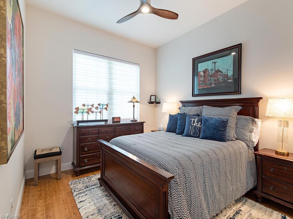901 Marblehead Drive, Unit B1 Naples, FL 34104 - Photo 8 of 13 a bedroom with a bed and a window