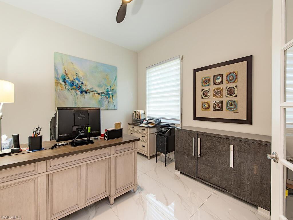 901 Marblehead Drive, Unit B1 Naples, FL 34104 - Photo 9 of 13 a kitchen with stainless steel appliances a stove a sink and a refrigerator