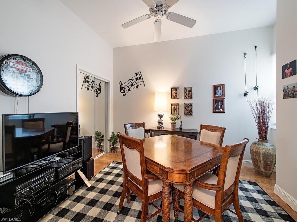 901 Marblehead Drive, Unit B1 Naples, FL 34104 - Photo 10 of 13 a dining room with furniture and wooden floor
