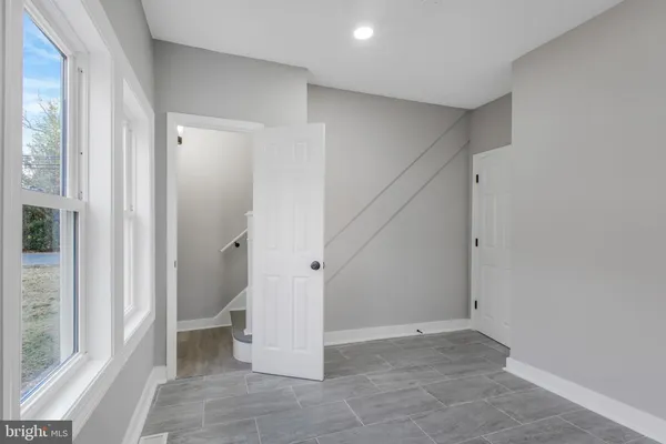 a view of an empty room with a hallway