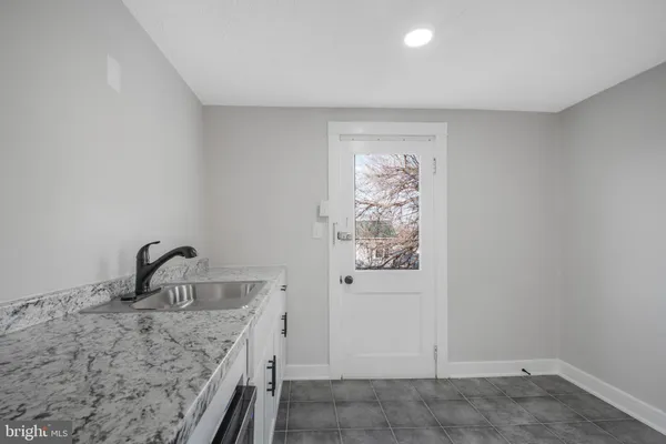 a room with a sink and a window