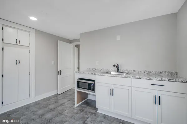 a view of cabinets with wooden floor