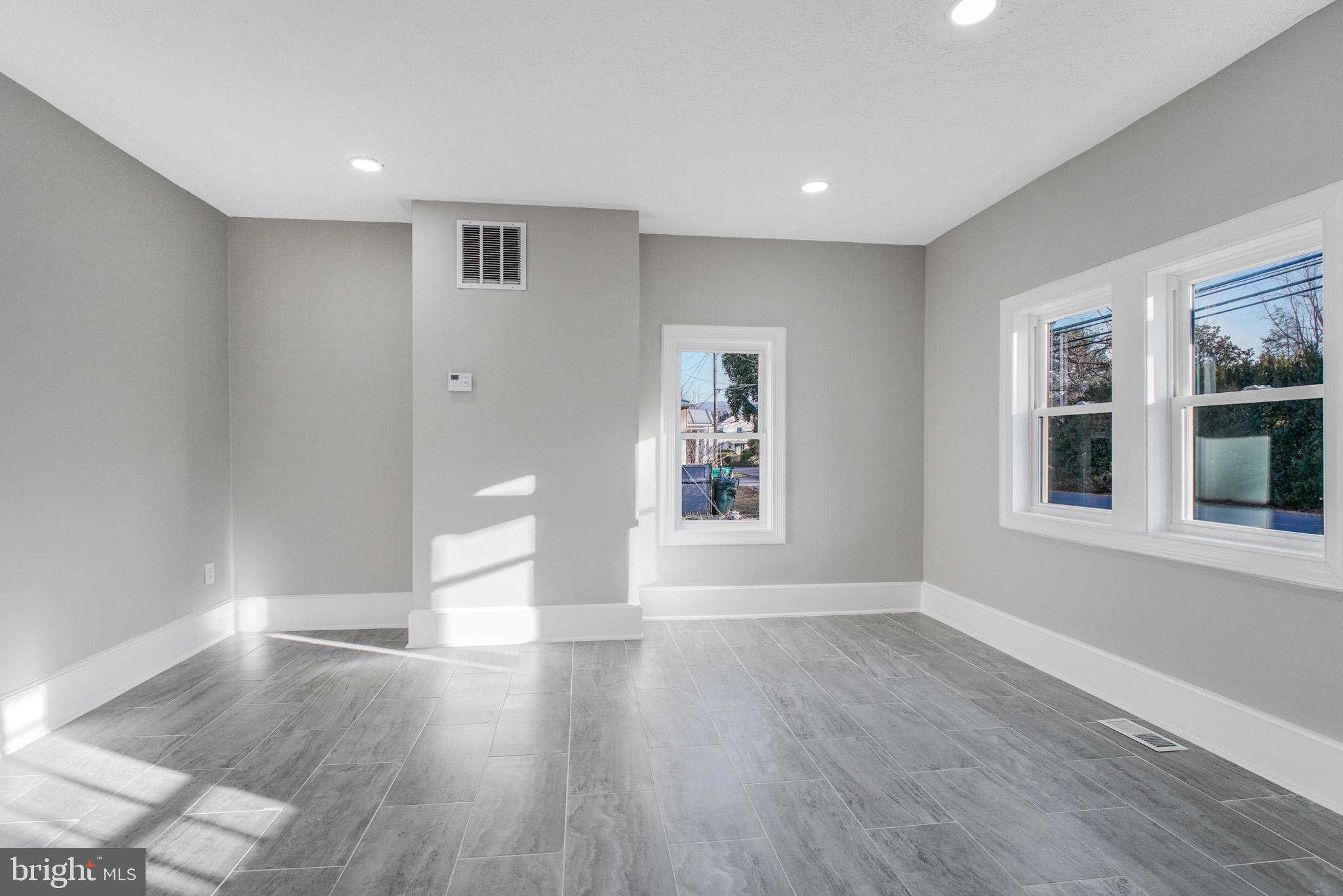 125 High Street Luray, VA 22835 - Photo 3 of 31 a view of empty room with wooden floor and fan
