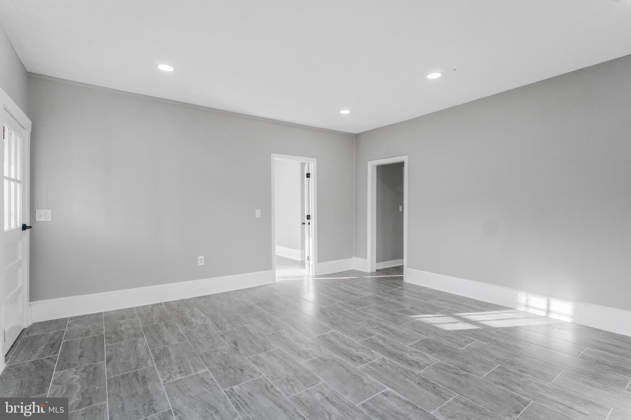125 High Street Luray, VA 22835 - Photo 4 of 31 a view of an empty room with wooden floor and a window