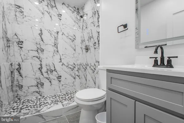 a bathroom with a toilet and a sink