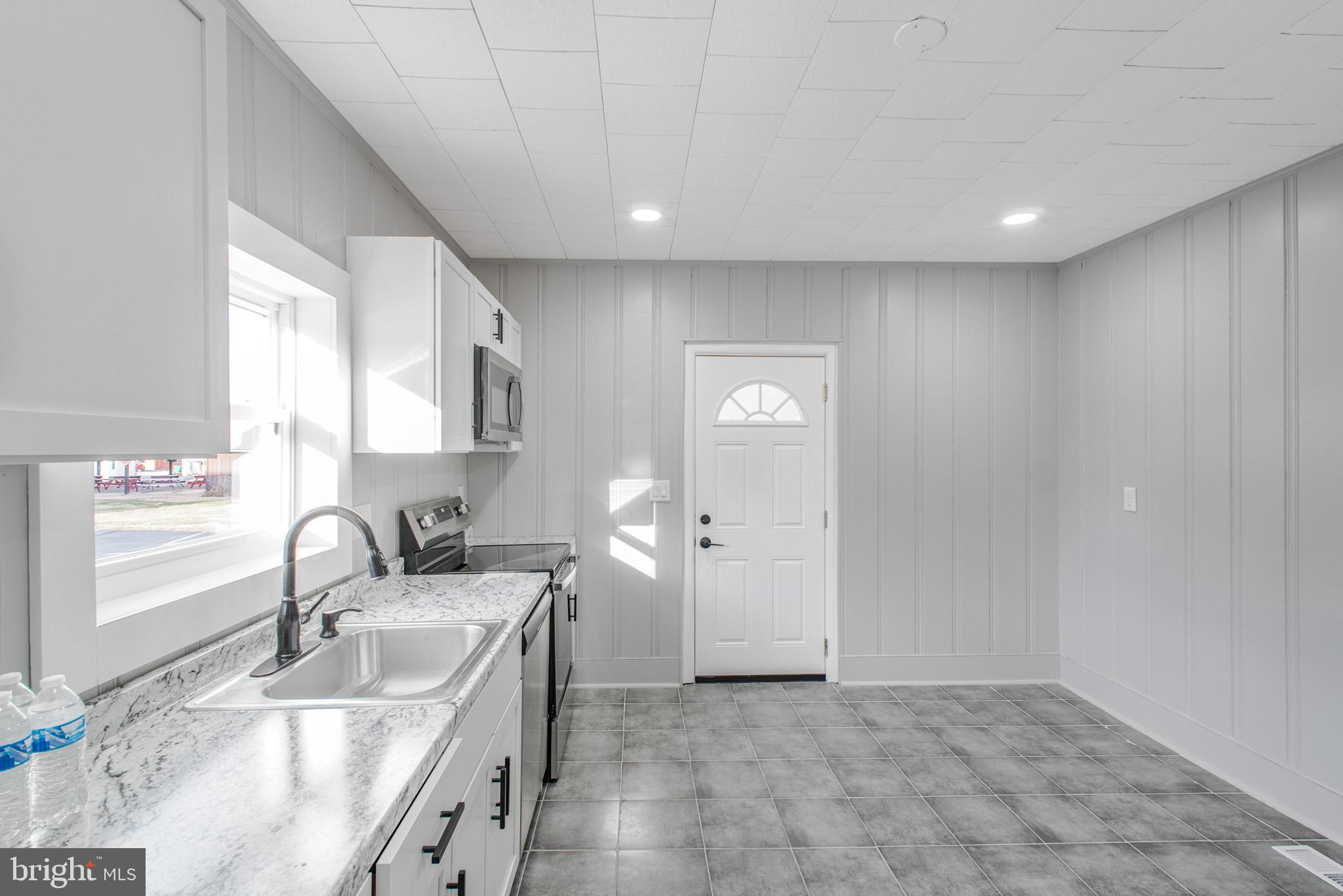 125 High Street Luray, VA 22835 - Photo 8 of 31 a bathroom with a sink and a mirror