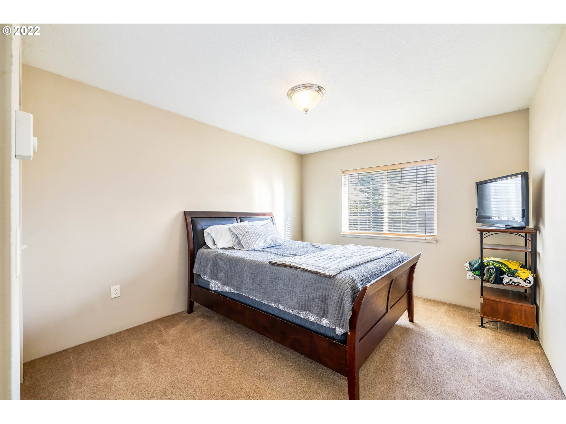1849 8th Street Springfield, OR 97477 - Photo 17 of 32 a room with a bed and a table in it