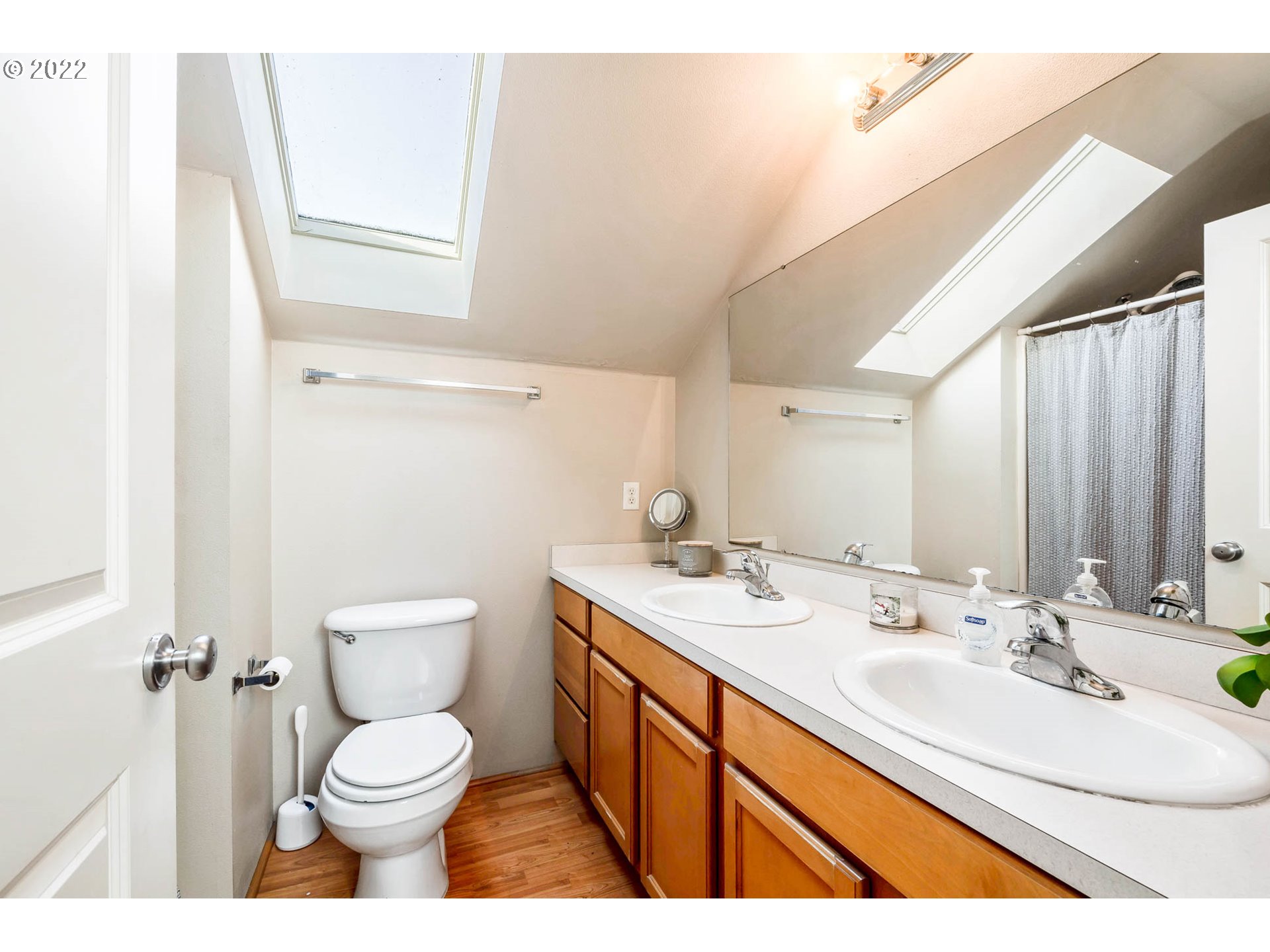 1849 8th Street Springfield, OR 97477 - Photo 20 of 32 a bathroom with a sink a toilet and a mirror