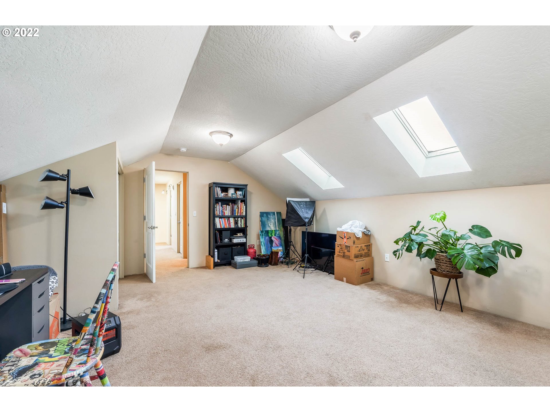 1849 8th Street Springfield, OR 97477 - Photo 22 of 32 a view of a livingroom with furniture and a ceiling fan