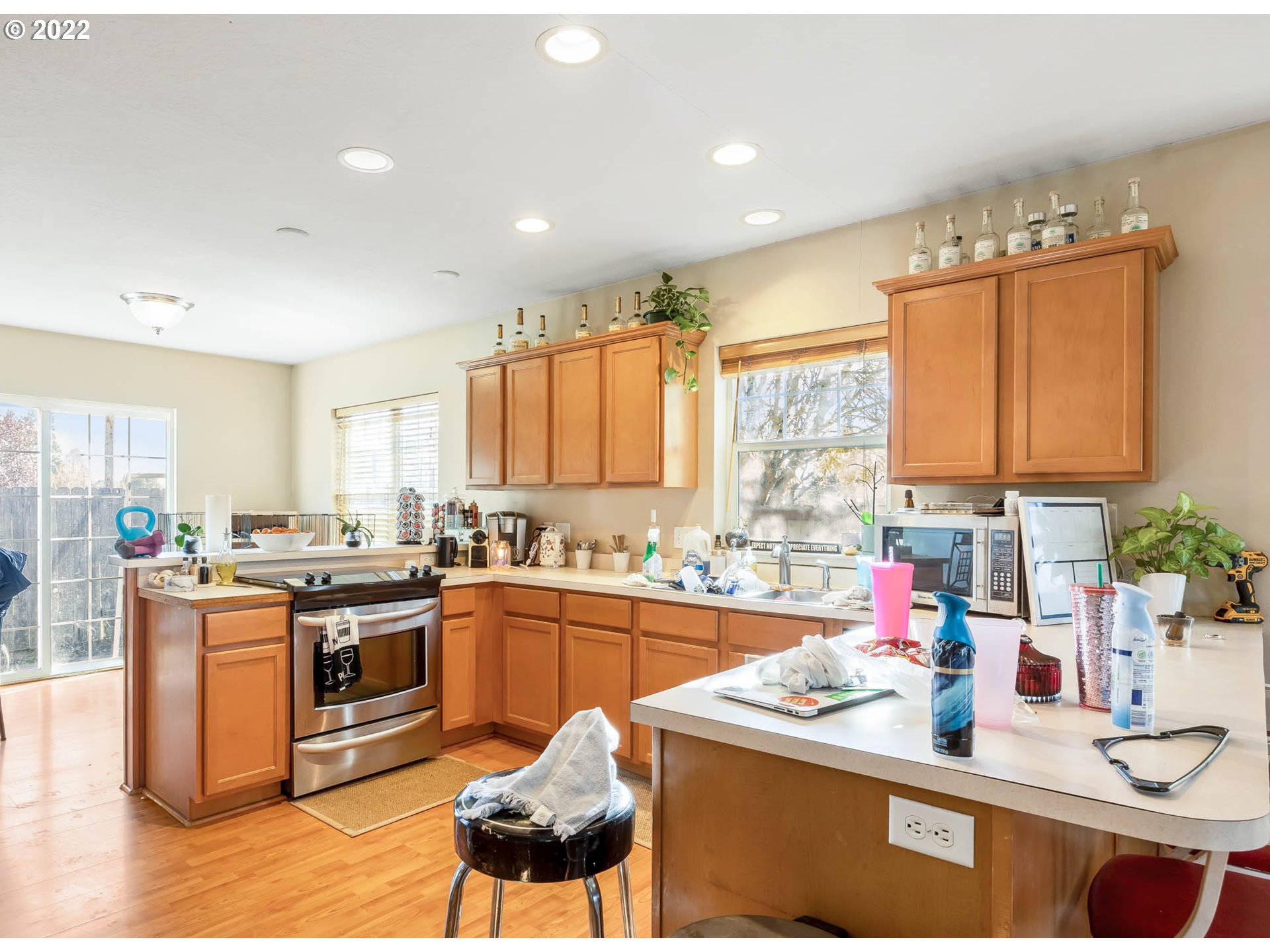 1849 8th Street Springfield, OR 97477 - Photo 26 of 32 a kitchen with stainless steel appliances granite countertop a sink stove and cabinets
