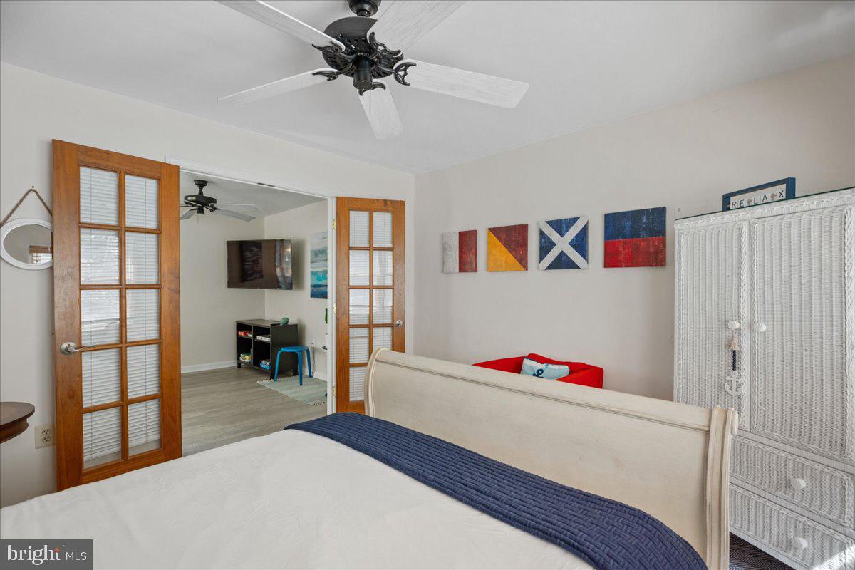 219 Calvert Drive Lusby, MD 20657 - Photo 20 of 51 a bedroom with furniture and window