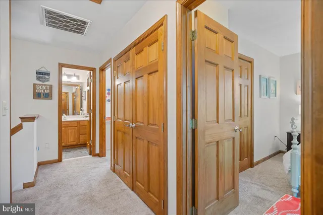 a view of a hallway with a livingroom