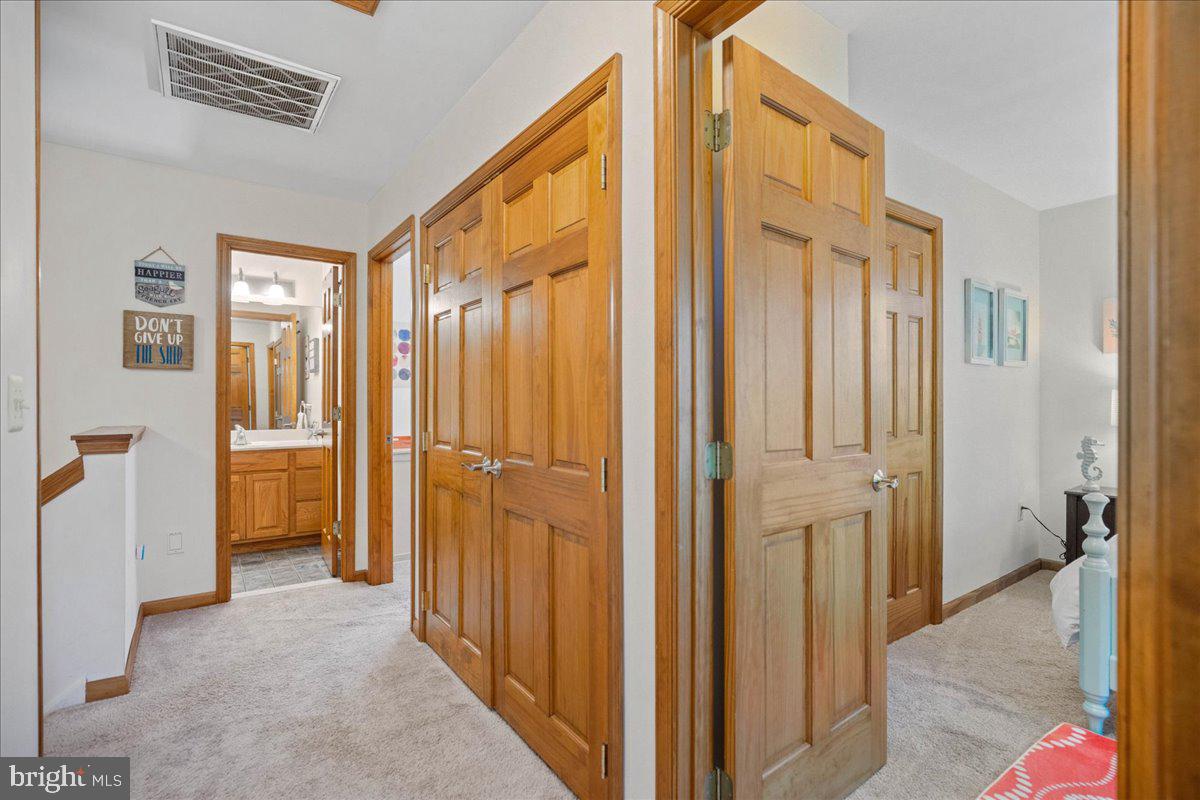 219 Calvert Drive Lusby, MD 20657 - Photo 33 of 51 a view of a hallway with a livingroom