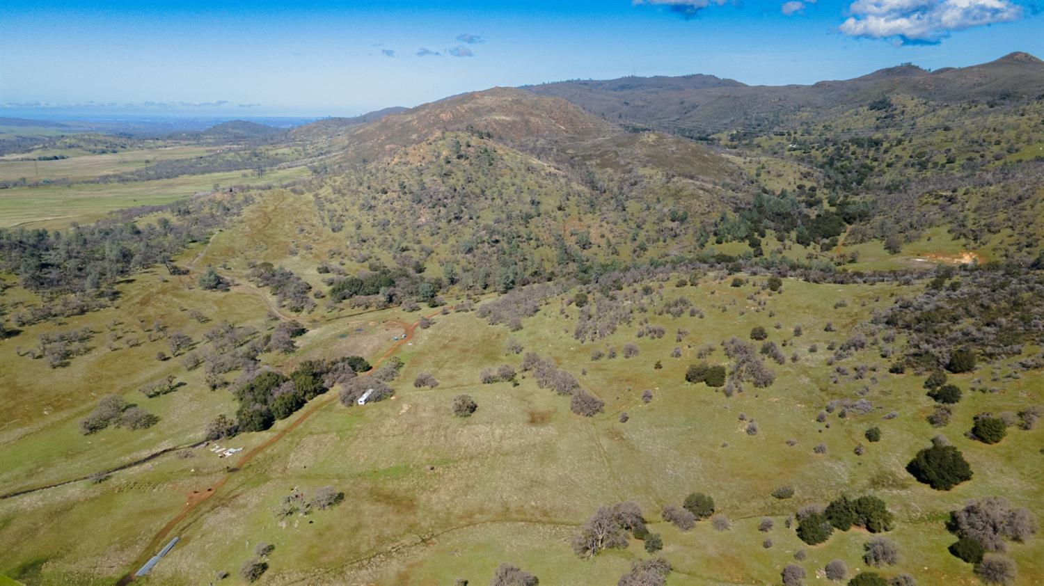 0 3 Hunt Road Farmington, CA 95228 - Photo 6 of 22 a view of a dry yard with mountains
