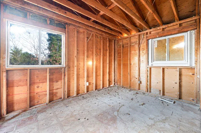 a view of empty room with floor to ceiling window