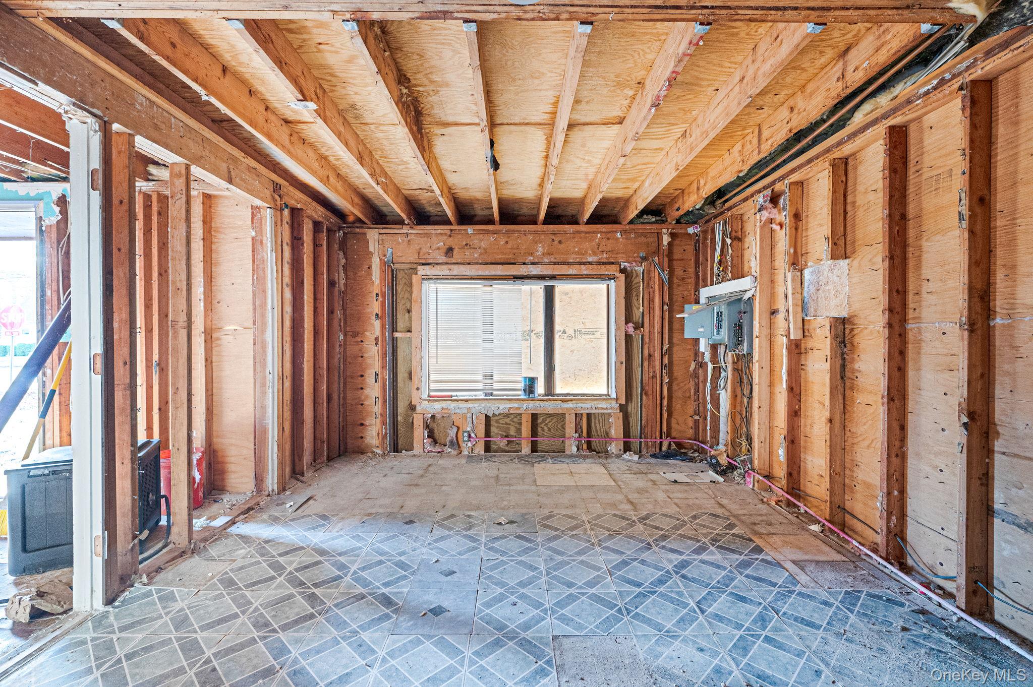 53 Hounslow Road Shirley, NY 11967 - Photo 6 of 18 a view of front door with furniture and a window
