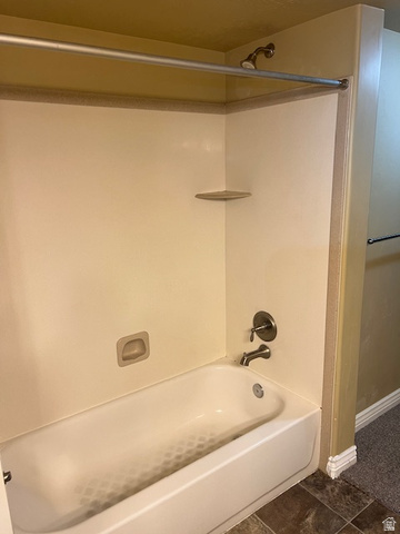 917 South Main Street, Unit H Layton, UT 84041 - Photo 13 of 19 Bathroom featuring bathing tub / shower combination and dark tile patterned flooring