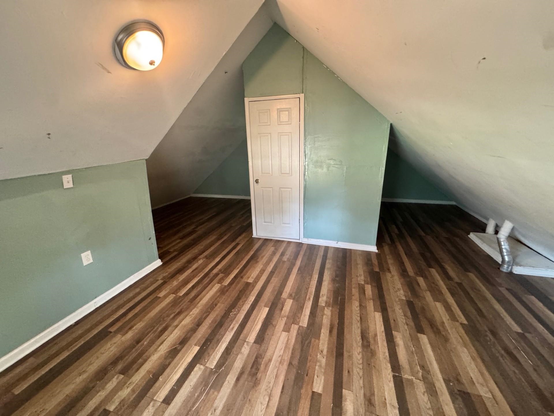 4564 Stage Road Memphis, TN 38128 - Photo 11 of 15 Bonus room with lofted ceiling and dark wood finished floors