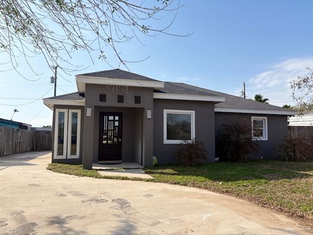 8509 North Kenyon Road Edinburg, TX 78542 - Photo 1 of 1 View of front facade with a front lawn