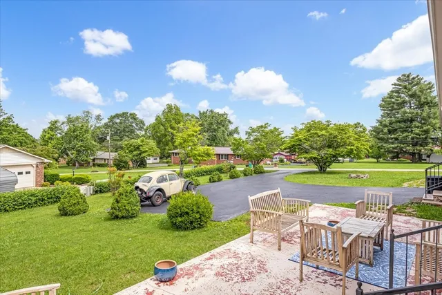 a view of a golf course with chairs