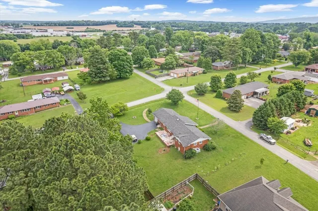 an aerial view of a house with a garden
