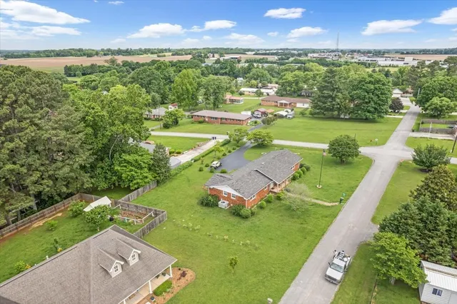 an aerial view of a house with a garden