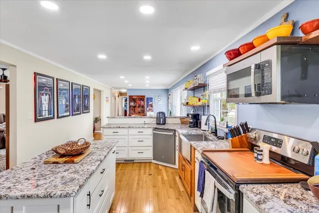 a kitchen that has a lot of cabinets in it