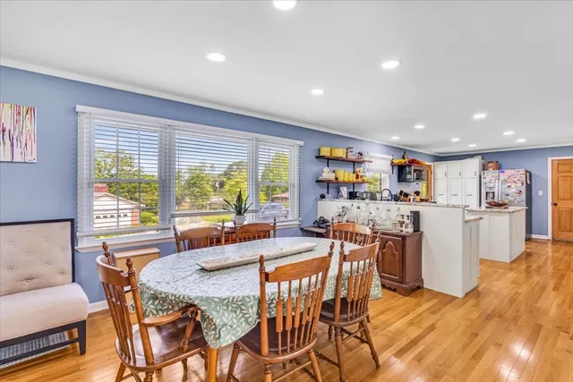 a view of a dining room with furniture window and outside view