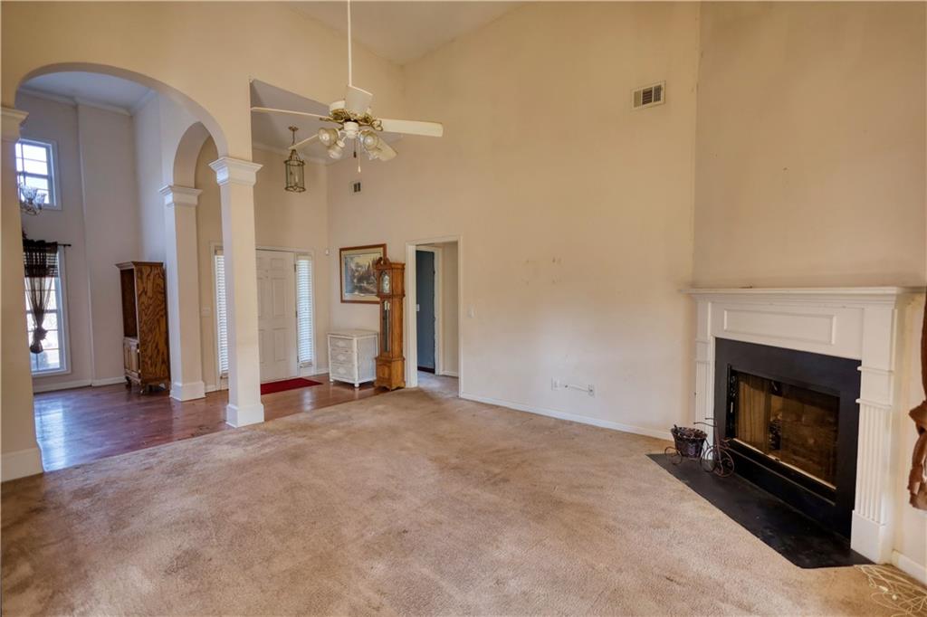 2648 Neighborhood Walk Villa Rica, GA 30180 - Photo 11 of 40 a view of a livingroom with a fireplace and wooden floor