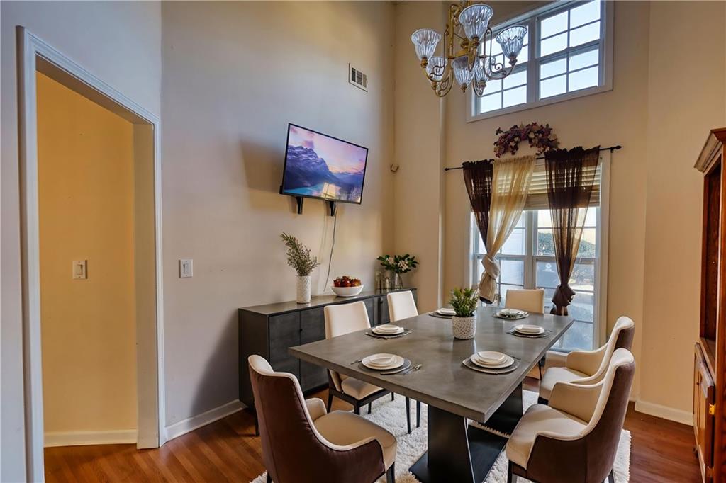 2648 Neighborhood Walk Villa Rica, GA 30180 - Photo 13 of 40 a view of a dining room with furniture and wooden floor